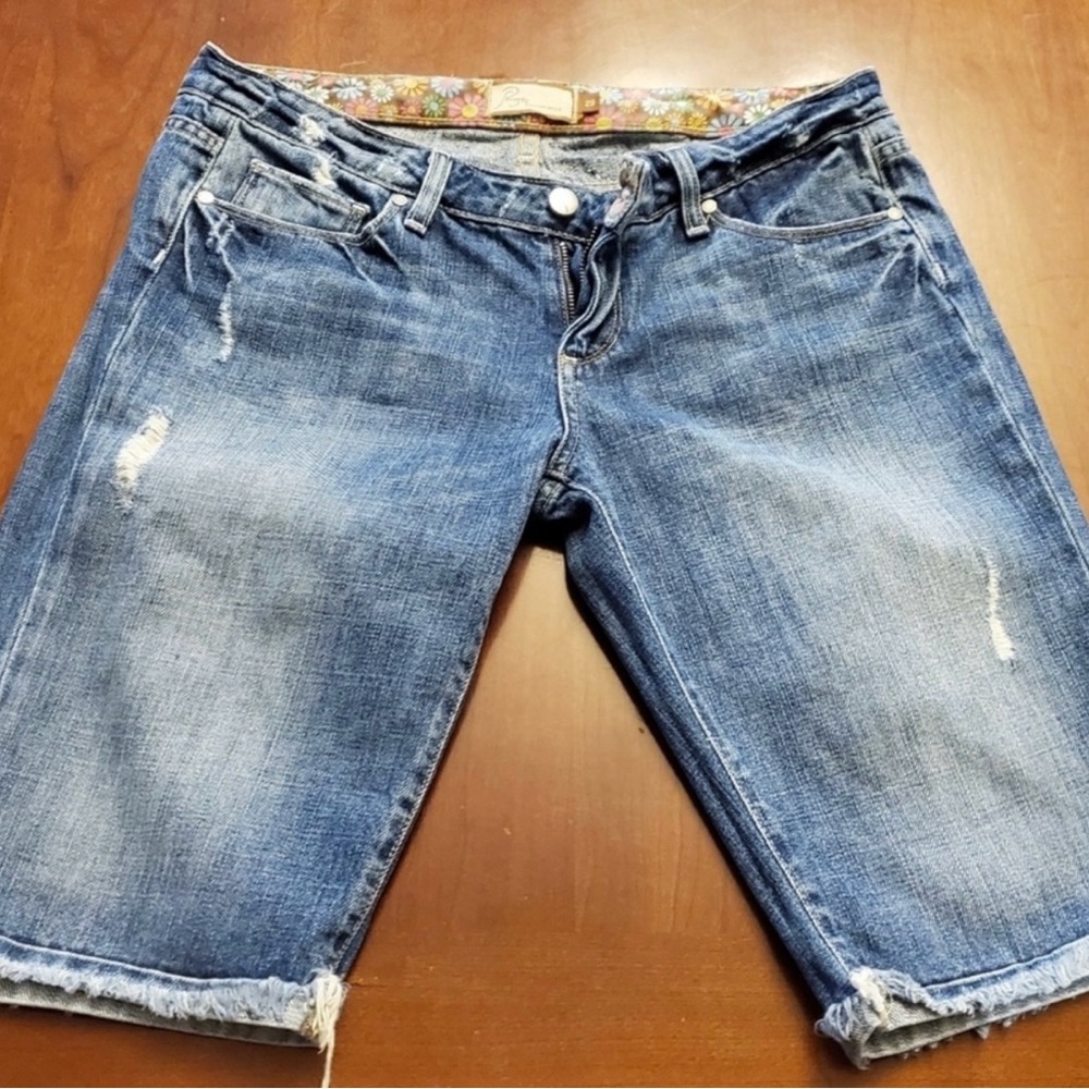 PAIGE Distressed Blue Jean Shorts are a size 29’
